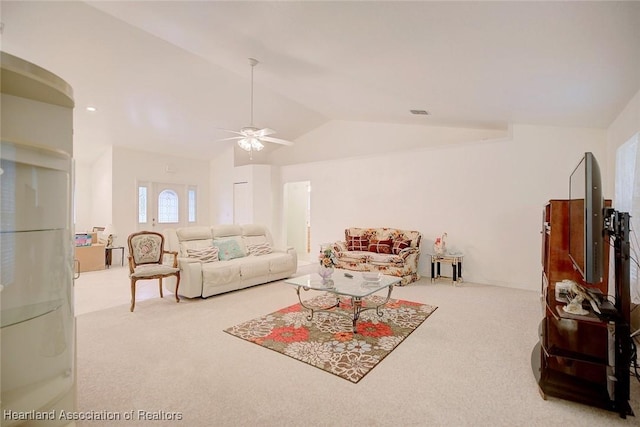 carpeted living room featuring ceiling fan and lofted ceiling