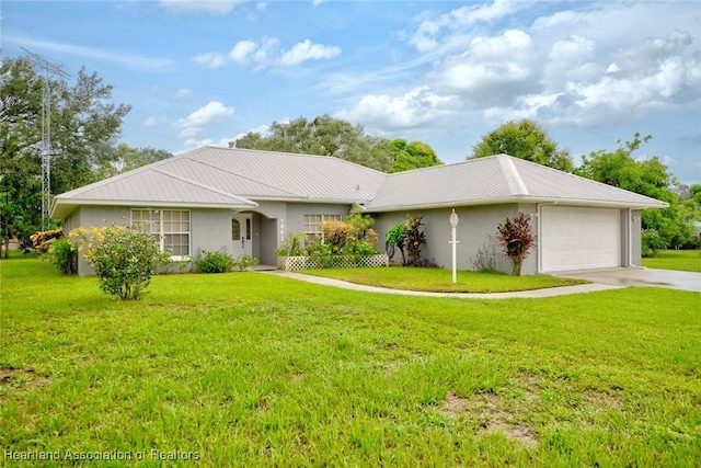 ranch-style home featuring a garage and a front yard