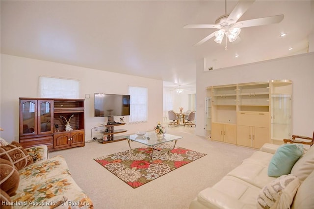 carpeted living room featuring ceiling fan