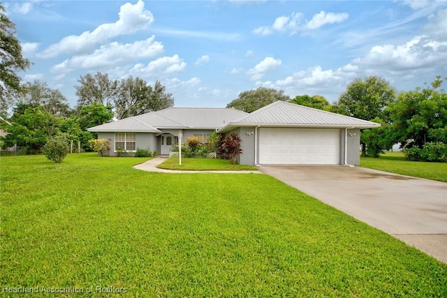 single story home featuring a garage and a front lawn