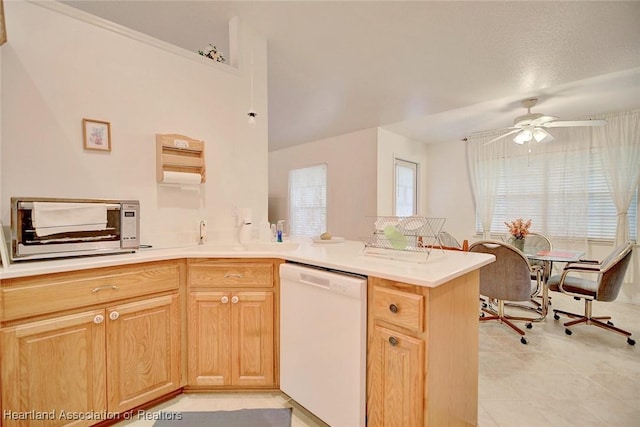 kitchen with kitchen peninsula, light brown cabinetry, a textured ceiling, white dishwasher, and ceiling fan