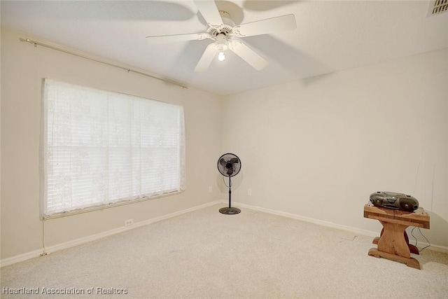 miscellaneous room with light carpet and ceiling fan