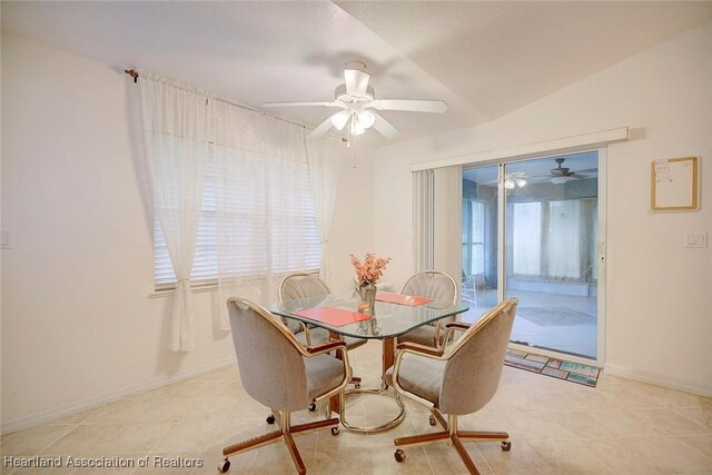 dining space with lofted ceiling