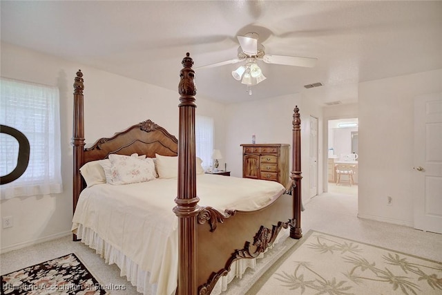 carpeted bedroom featuring connected bathroom and ceiling fan