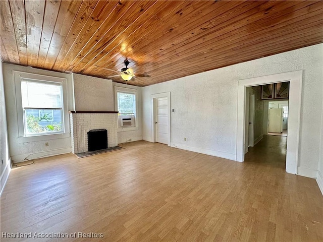 unfurnished living room with ceiling fan, wooden ceiling, a brick fireplace, cooling unit, and hardwood / wood-style flooring