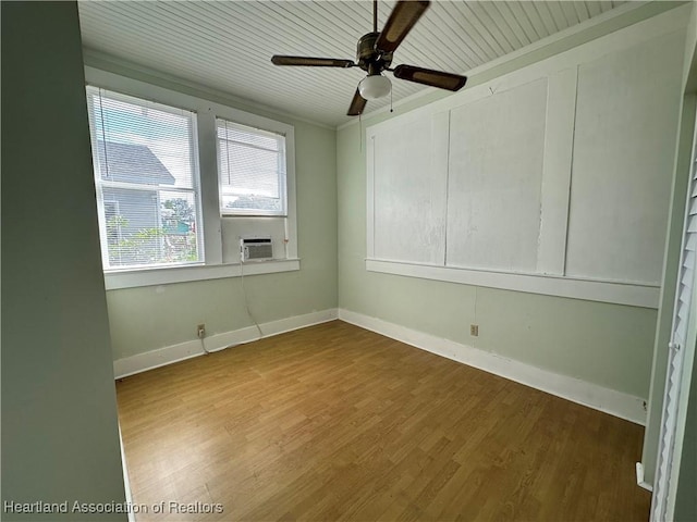 spare room with hardwood / wood-style flooring, ceiling fan, and wooden ceiling