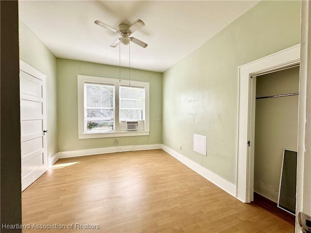 unfurnished bedroom featuring a closet, light hardwood / wood-style floors, and ceiling fan