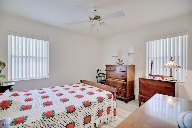 bedroom featuring ceiling fan and light hardwood / wood-style flooring