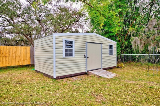 view of outdoor structure with a yard