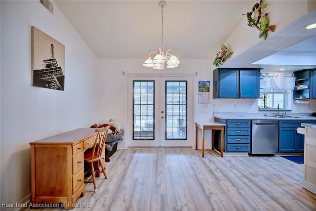 kitchen featuring light hardwood / wood-style floors, french doors, vaulted ceiling, pendant lighting, and stainless steel dishwasher