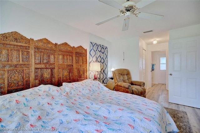 bedroom featuring ceiling fan and light hardwood / wood-style floors