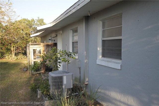 1820 W Batavia Rd, Avon Park, FL 33825 - view of home's exterior featuring central AC and stucco siding