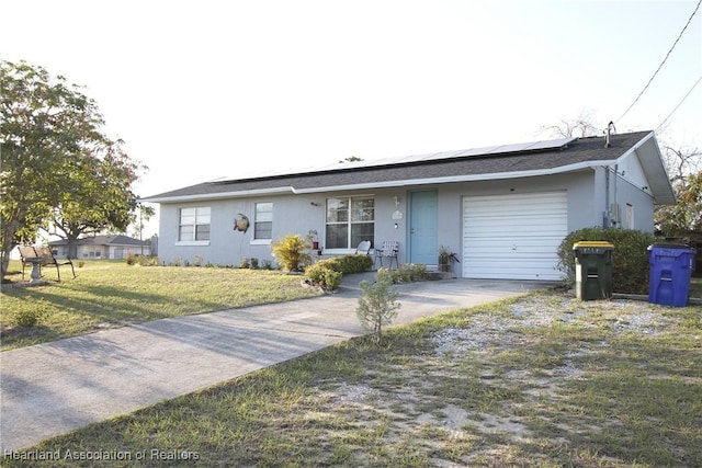 1820 W Batavia Rd, Avon Park, FL 33825 - ranch-style home featuring a garage, roof mounted solar panels, a front lawn, and stucco siding