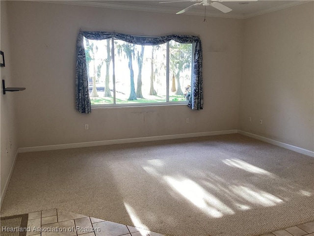 unfurnished room with ceiling fan, light colored carpet, and ornamental molding