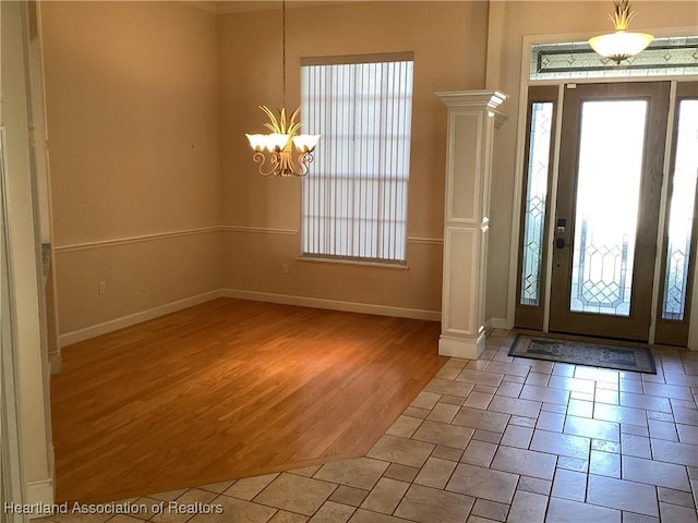 entryway featuring a chandelier and hardwood / wood-style flooring