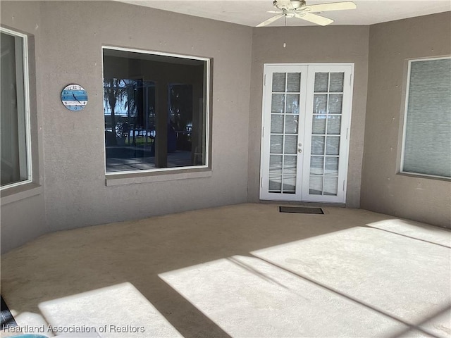 view of patio with ceiling fan and french doors