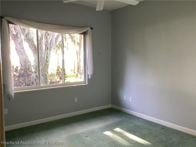 carpeted empty room with ceiling fan