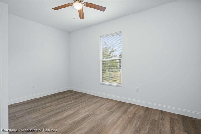 unfurnished room featuring ceiling fan and hardwood / wood-style flooring