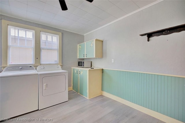 washroom with washer and clothes dryer, cabinets, ceiling fan, light wood-type flooring, and ornamental molding