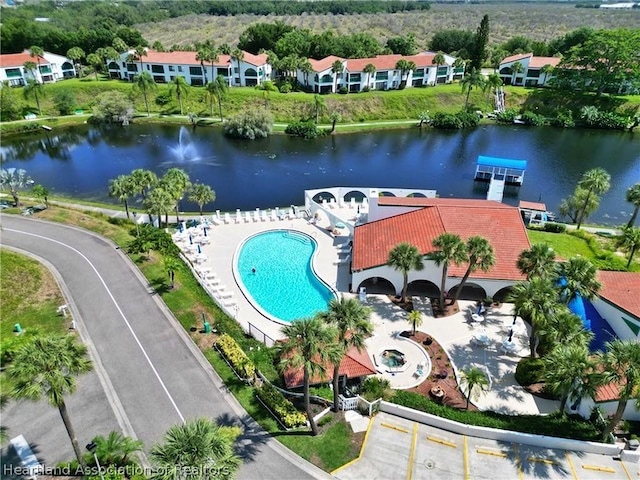 birds eye view of property featuring a water view