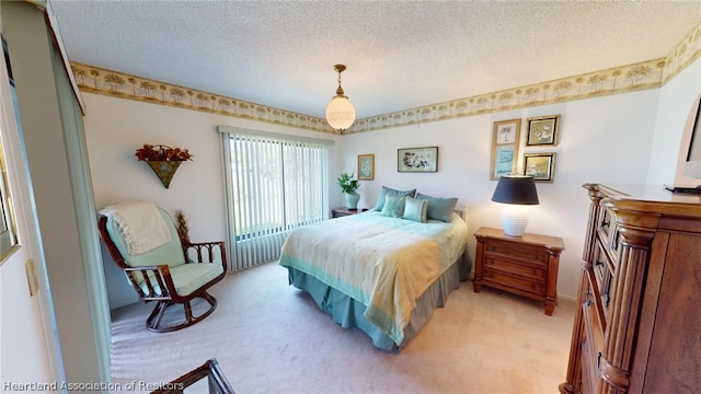 carpeted bedroom with a textured ceiling