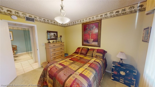 tiled bedroom with a textured ceiling