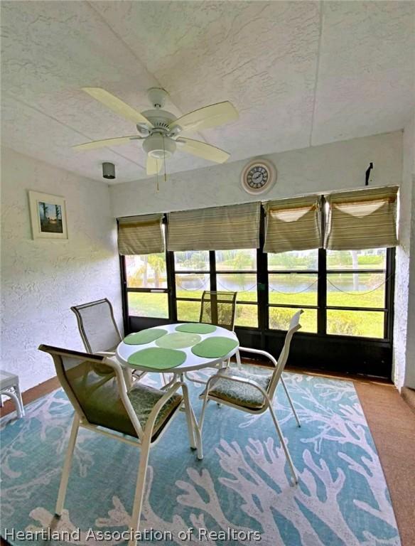 sunroom / solarium with ceiling fan