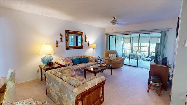 living room featuring light colored carpet and ceiling fan