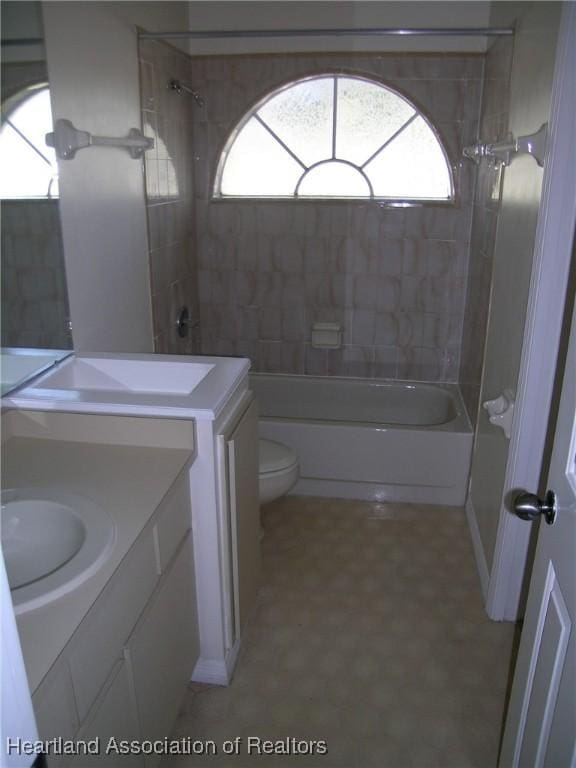 full bath with toilet, shower / tub combination, and vanity