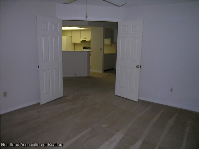 unfurnished room with baseboards and light wood finished floors