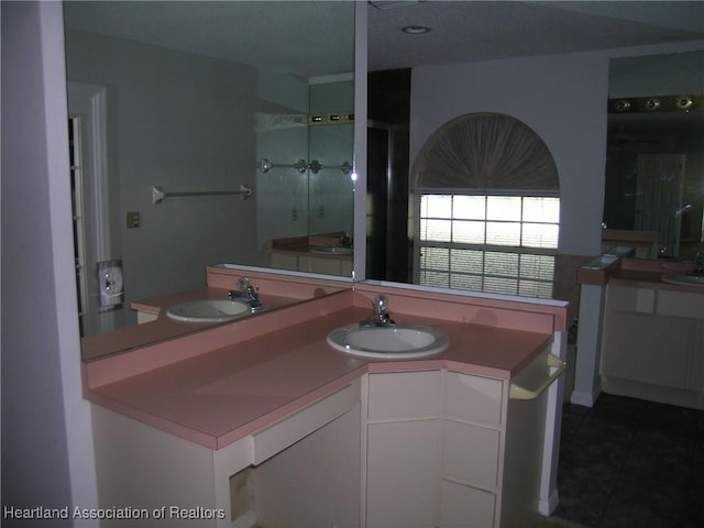 bathroom with a sink and tile patterned floors