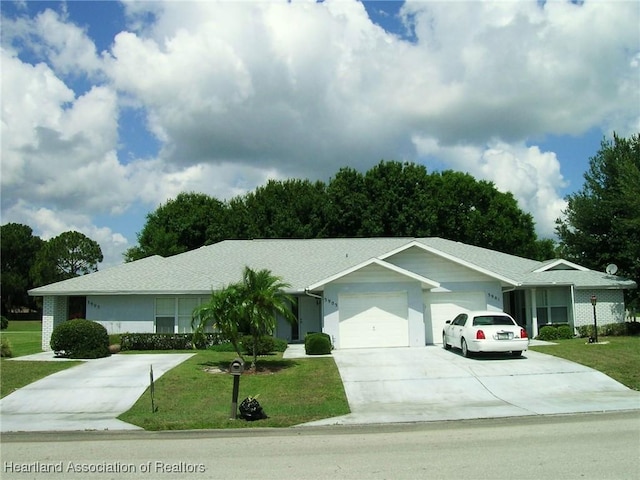 ranch-style home featuring a garage, a front yard, and concrete driveway