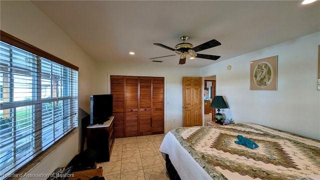 bedroom featuring ceiling fan and a closet