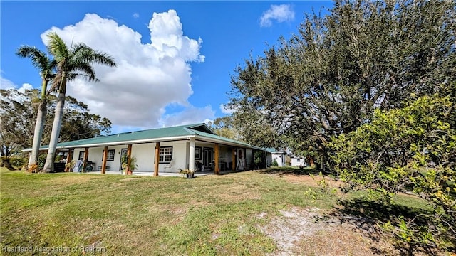 view of home's exterior featuring a lawn