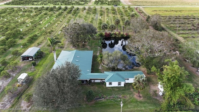 drone / aerial view with a water view and a rural view