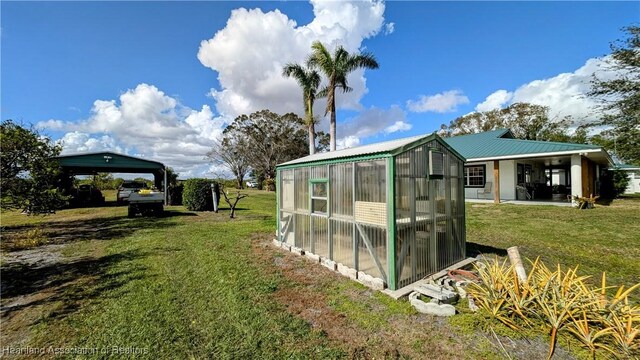 view of outbuilding with a lawn