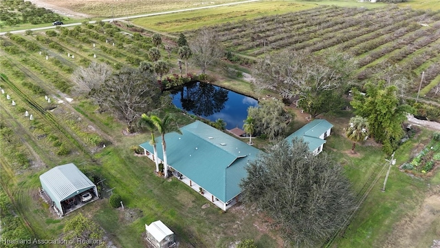 birds eye view of property with a water view and a rural view