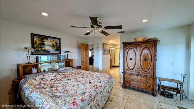 tiled bedroom featuring ceiling fan