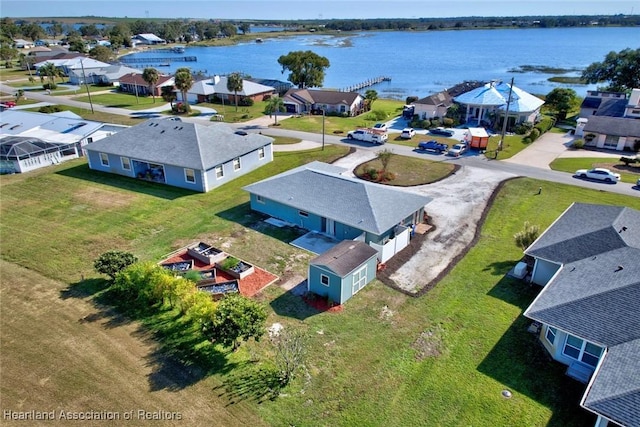 birds eye view of property with a water view