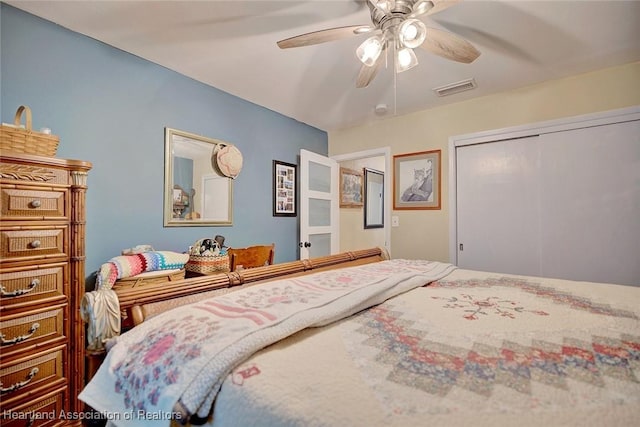 bedroom featuring ceiling fan and a closet