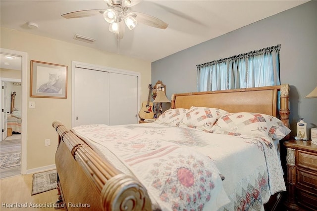 bedroom featuring a closet, ceiling fan, and hardwood / wood-style flooring