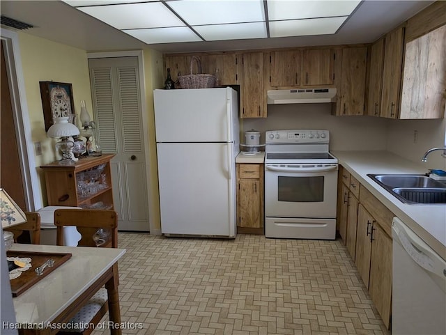 kitchen with white appliances and sink