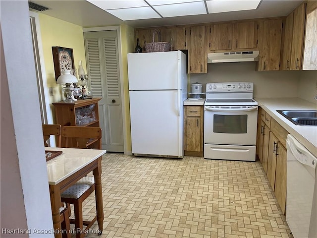 kitchen with white appliances and sink