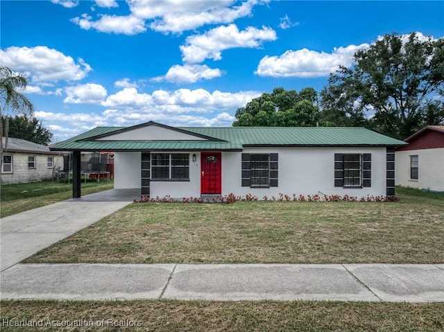 ranch-style house with a carport and a front lawn