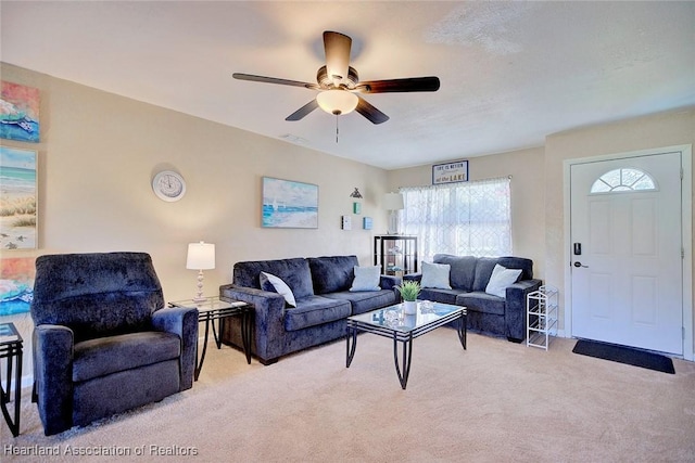 living room featuring ceiling fan and light carpet