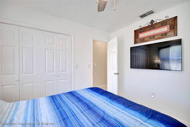 unfurnished bedroom with a closet and ceiling fan