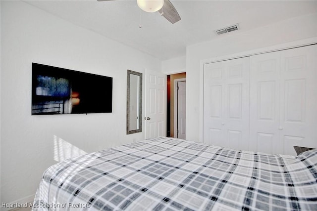 bedroom featuring ceiling fan and a closet