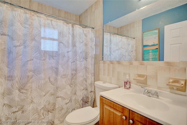 bathroom with toilet, walk in shower, vanity, and decorative backsplash