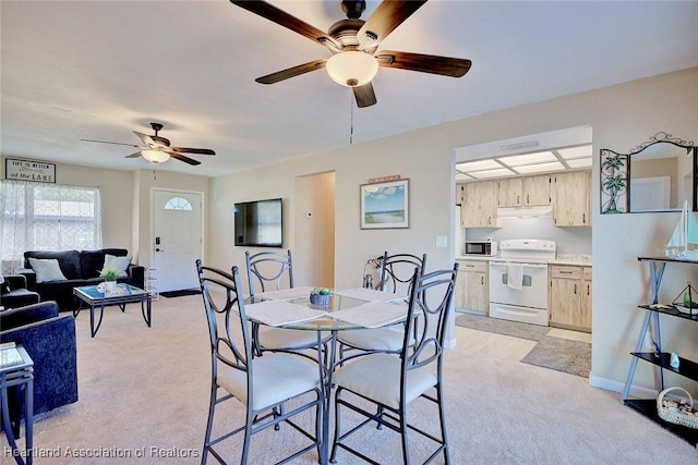 view of carpeted dining space