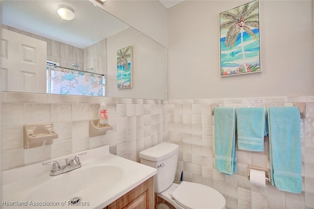 bathroom featuring vanity, tile walls, walk in shower, and toilet